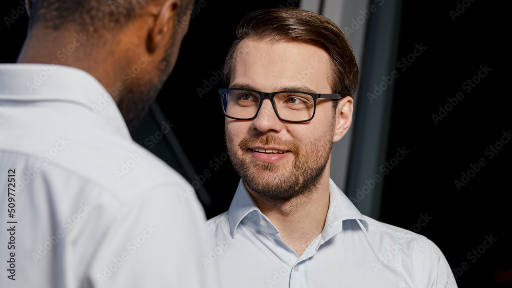 Fototapeta premium Business discussion: two professionals talking indoors