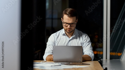 Wallpaper Mural Young ceo typing message on laptop keyboard in office Torontodigital.ca