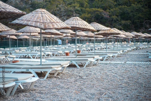 Fototapeta Naklejka Na Ścianę i Meble -  beach chairs and umbrellas on the beach