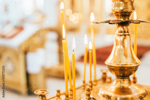 Valokuvatapetti Burning candles in the Orthodox Church