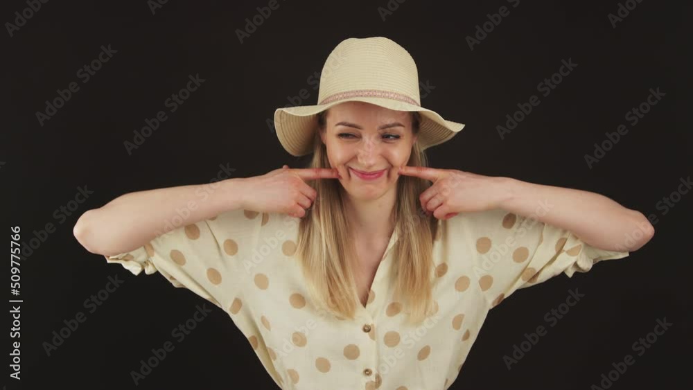 Funny young caucasian blond woman touching her chicks with index fingers over black background. High quality 4k footage Funny young caucasian blond woman touching her chicks with index fingers over black background. High quality 4k footage