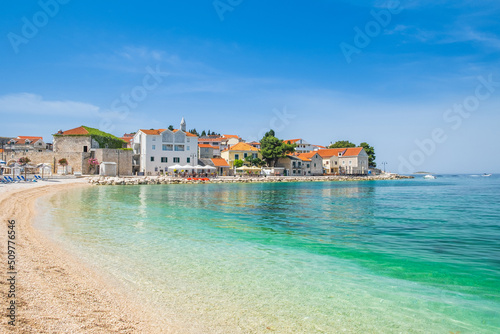 Sand beach in front of old town of Primosten, Dalmatia, Croatia, Europe