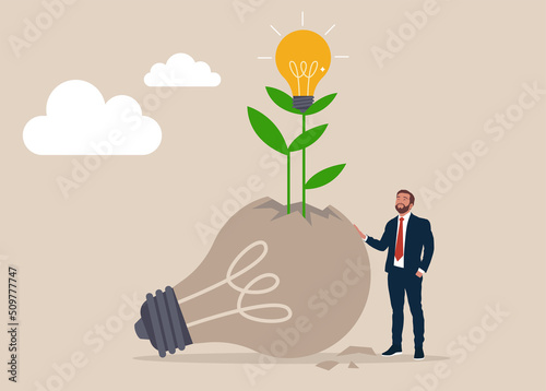 Entrepreneur look at seedling bright light bulb idea plant grow from broken one. Fail to success, aspiration and effort to invent new innovation, learn from mistake or motivation to success.