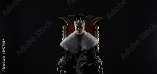 medieval king on the throne photo