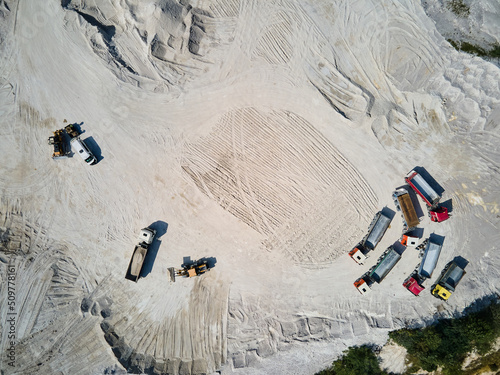 Aerial view trucks near quarry extraction porcelain clay, kaolin