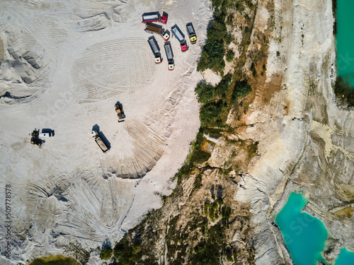 Aerial view trucks near quarry extraction porcelain clay, kaolin