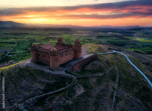 Aerial shot of a castle at sunset in Andalucia
