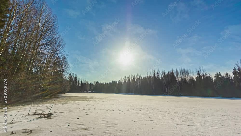 custom made wallpaper toronto digital24 hours time-lapse of a frozen lake with trees in winter.