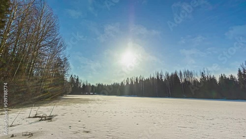 Wallpaper Mural 24 hours time-lapse of a frozen lake with trees in winter. Torontodigital.ca
