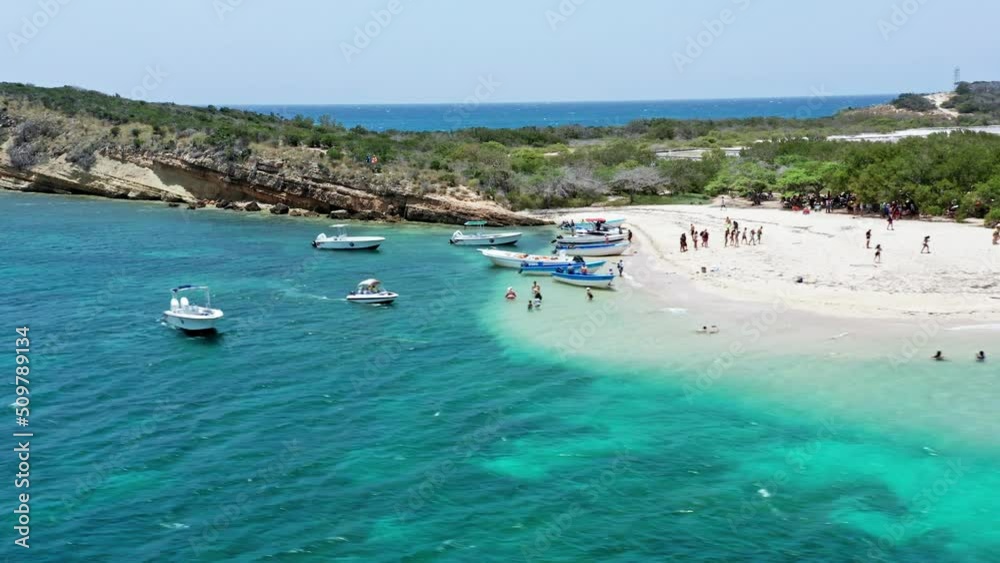 Tourists on tour of secluded tropical islet near Montecristi, Isla Cabra; drone Tourists on tour of secluded tropical islet near Montecristi, Isla Cabra; drone