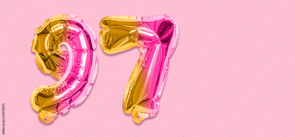 Rainbow foil balloon number, digit ninety seven on a pink background. Birthday greeting card with inscription 97. Top view. Numerical digit. Celebration event, template. Banner Rainbow foil balloon number, digit ninety seven on a pink background. Birthday greeting card with inscription 97. Top view. Numerical digit. Celebration event, template. Banner
