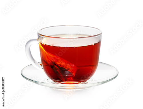 tea bag in a cup isolated on white. cherry tone.