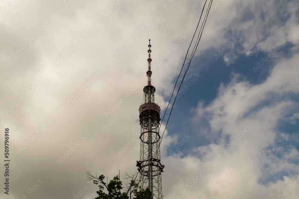 Communication tower with antenna and satellite dish telecom network on blue sky background Communication tower with antenna and satellite dish telecom network on blue sky background