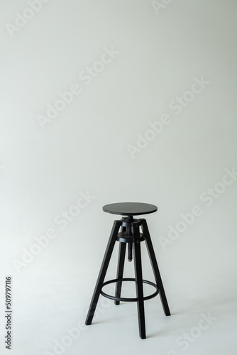 Black wooden stool on a white background