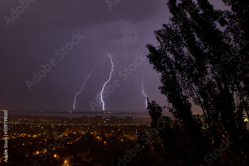 Lightning strikes a multi-story building at night