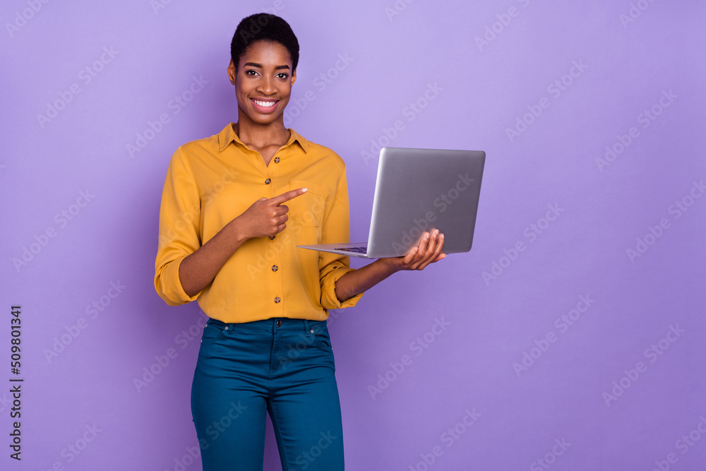 Photo of young lady guy indicate figner laptop select suggest recommend promo isolated over purple color background Photo of young lady guy indicate figner laptop select suggest recommend promo isolated over purple color background