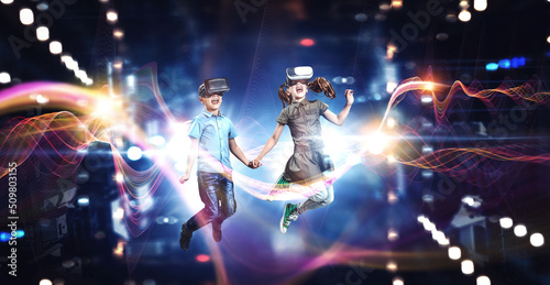Kids wearing virtual reality goggles