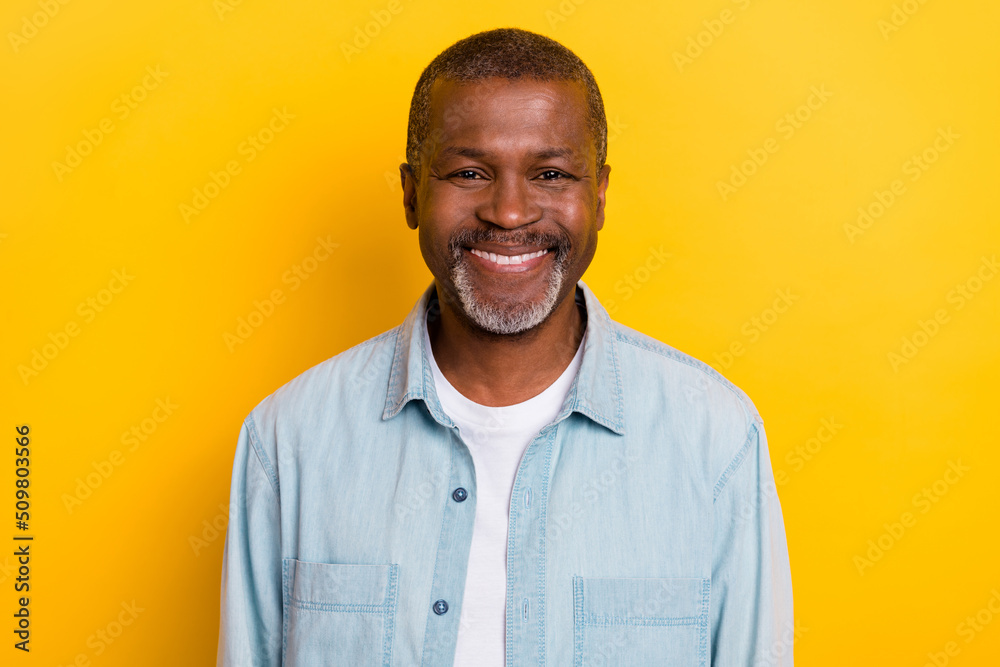 Portrait of satisfied glad candid person beaming smile look camera isolated on yellow color background