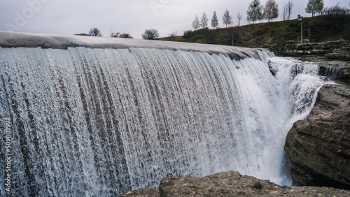 Niagara Falls near the capital Podgorica in Montenegro. Montenegrin landmark. Niagara Falls on the Tsievna River, which flows from the Prokletie National Park to the Skadar Lake. Water beats on stone photo