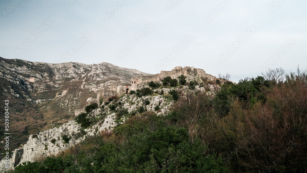 The dilapidated fortress Haj Nehaj.
Fortress in Sutomore Montenegro. Medieval fortress built by the Venetians on the territory of the Montenegrin coast. Great views from the mountains. Budva Riviera. The dilapidated fortress Haj Nehaj.
Fortress in Sutomore Montenegro. Medieval fortress built by the Venetians on the territory of the Montenegrin coast. Great views from the mountains. Budva Riviera.