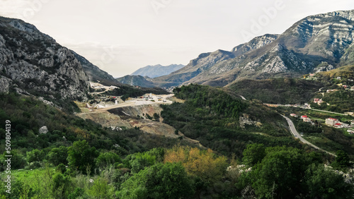 Mining industry in Budva. View of the mountains of Montenegro from the Haj Nehaj fortress. Production of building materials in Montenegro. Stationary concrete plant in Budva. Mining of rock