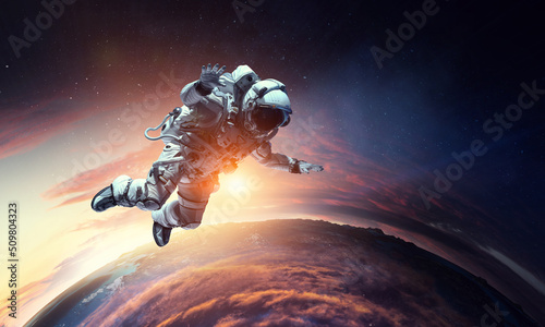 Fototapeta Naklejka Na Ścianę i Meble -  Astronaut at spacewalk . Mixed media