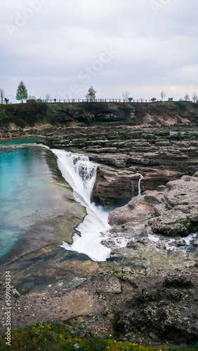Niagara Falls near the capital Podgorica in Montenegro. Montenegrin landmark. Niagara Falls on the Tsievna River, which flows from the Prokletie National Park to the Skadar Lake. Water beats on stone