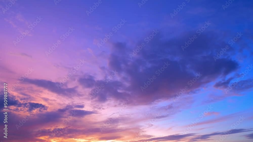4K Sky Time lapse of Colorful clouds during the moving sun. Beautiful cloud space weather beautiful blue sky background.
