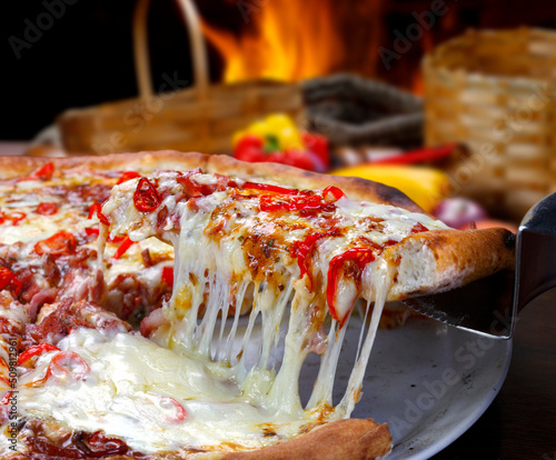 PizzaPepperoni pizza slice melted mozzarella cheese photo