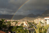 Rainbow over the city, Rainbow in the sky in Tenerife Canary Island, Teide mountain with rainbow, rainbow in the city centre, Spain
