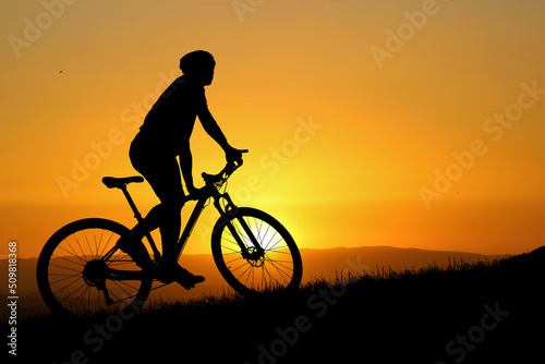 Fototapeta Naklejka Na Ścianę i Meble -  Silhouette of mountain bikers with beautiful views. bike exercise concept
