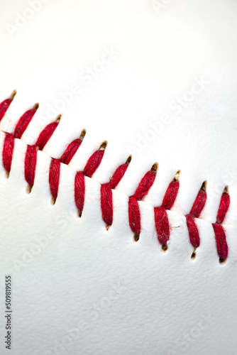 Close up macro of baseball stitch seam fibers and threads with a shallow depth of field and copy space