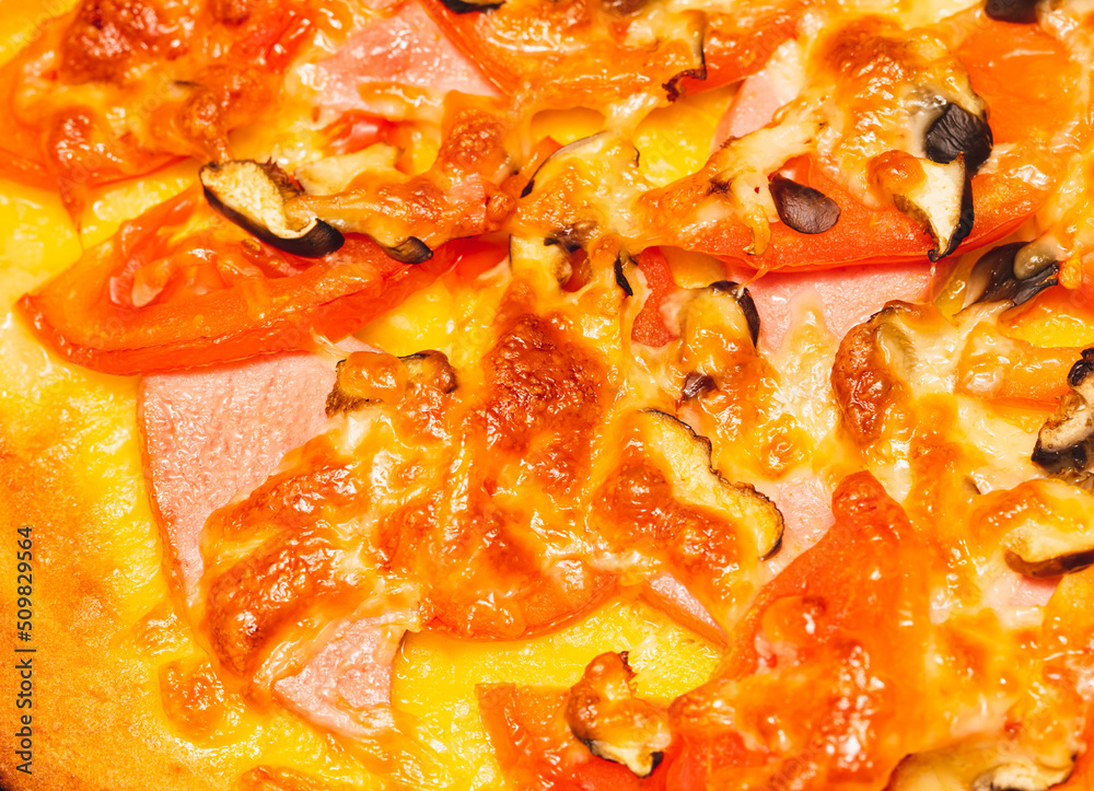 Pizza with tomatoes and sausage as a background. Pizza with tomatoes and sausage as a background.