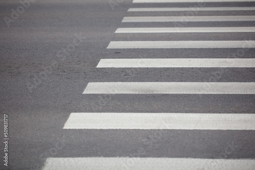 White stripes on the crosswalk.