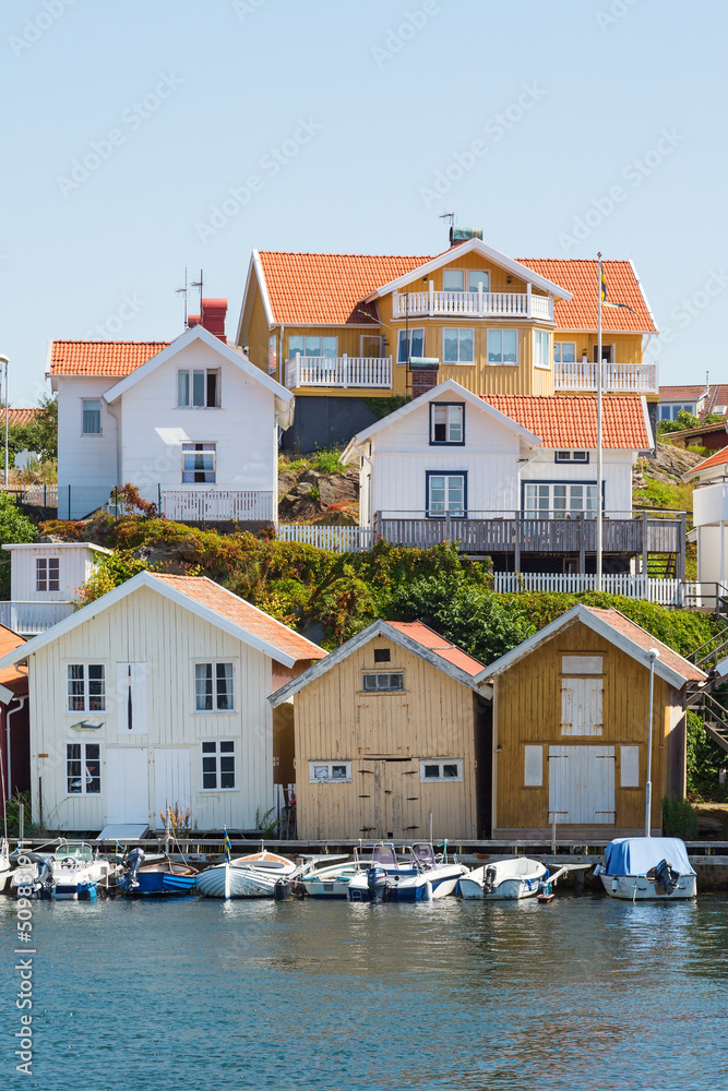 Houses and boats at the jetty on the coast