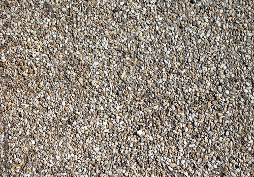 Small pebbles of crushed stone as an abstract background.