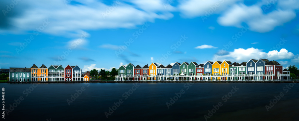 panorama view of the colorful rainbow houses and lake in Houten
