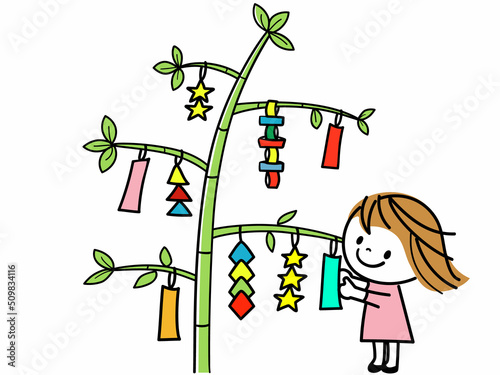 ササの葉に願い事を描いて飾ったり、色とりどりの装飾を楽しむかわいい女の子