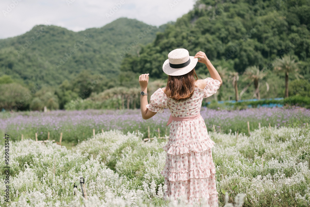 Young woman with bouquet in lavender field