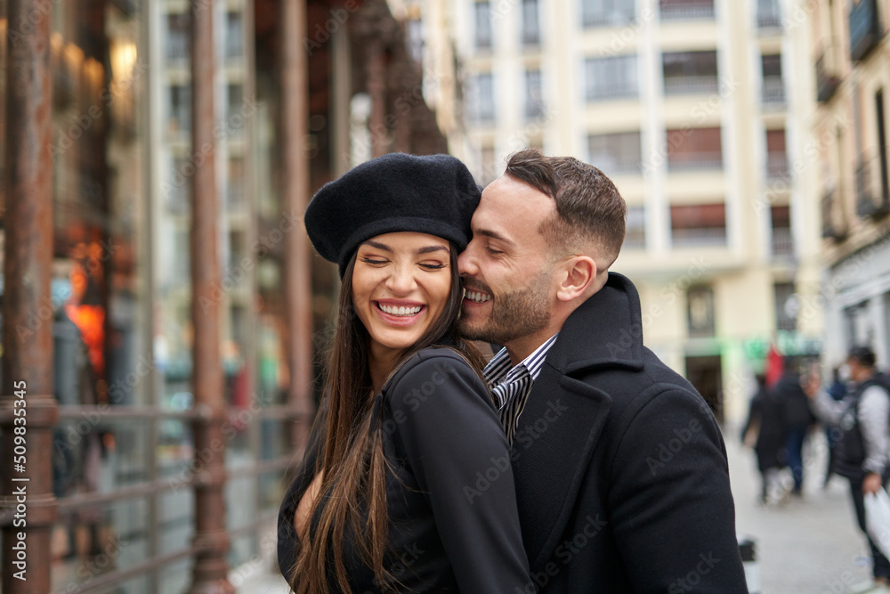 Cheerful couple caressing on street Cheerful couple caressing on street