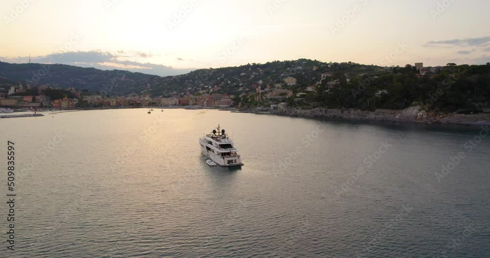 Luxury Yacht in Exotic Italy Coast near Portofino at Sunset, Aerial Orbit Luxury Yacht in Exotic Italy Coast near Portofino at Sunset, Aerial Orbit