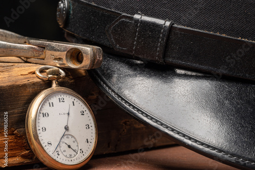 Railroad train engineers hat, ticket punch, and pocket watch