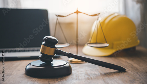 Judge's hammer and helmet Law and Justice about labor law concept Construction law. photo
