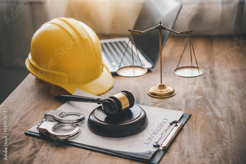Judge's hammer and helmet Law and Justice about labor law concept Construction law. photo