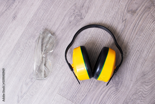 Protective construction glasses and headphones flat lay photo