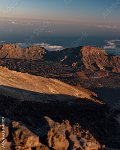 View from the peak of Mount Teide called 'Pico del Teide'. View of the caldera and volcanic landscape. Above the clouds. Teide National Park, Tenerife, Canary islands, Spain.