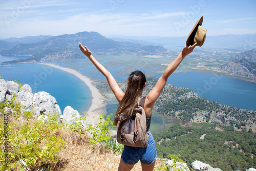 young woman trekking at the peak of dalyan Turkey