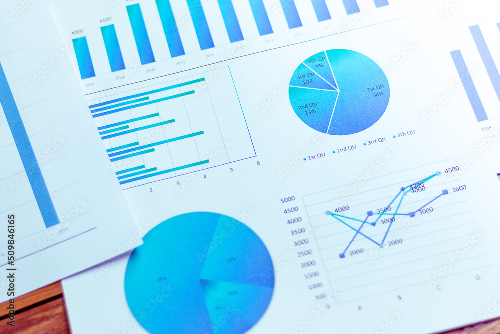 Charts and graphs are placed on the desks, data, and statistical performance of the company in the past year. Charts and graphs are placed on the desks, data, and statistical performance of the company in the past year.
