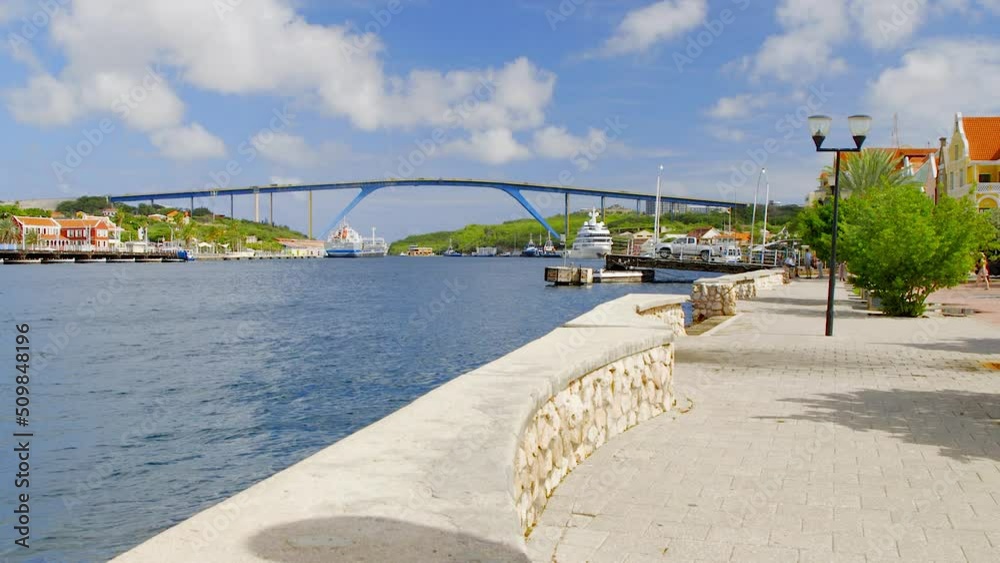 Queen Juliana Bridge in the beautiful Saint Anna Bay of Punda, Willemstad, on the Caribbean island of Curacao. Static wide angle