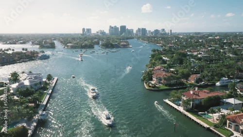 Boats Passing Through New River In Fort Lauderdale, Florida, USA. - aerial photo